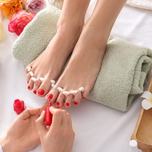 Young,Woman,Getting,Pedicure,In,Beauty,Salon